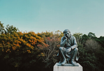 Statue of the sad person in the park
