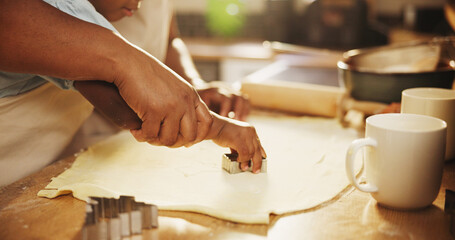 Obraz premium Baking, mom and hands of girl with dough or cookie cutter in kitchen for support, teaching skills and learning for growth or development. Mother, daughter and closeup in family house for helping.