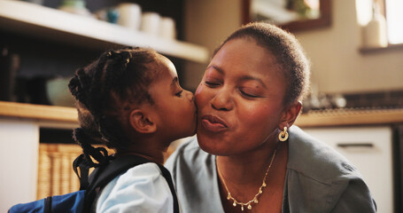 African woman, child and kiss for school, education, morning and support for childhood development. Mother, daughter and smile with affection, care and love in kitchen or home for bonding as family