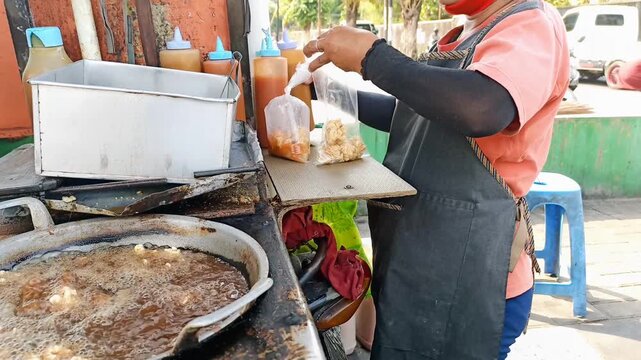 seller is bending over the Kentucky order from the customer who came in