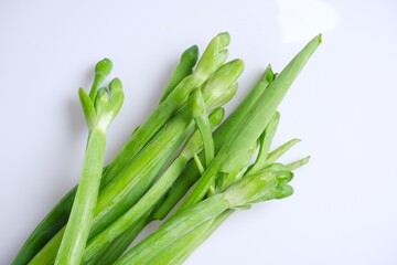 Green leaves and bouquet of yellow burhead or (limnocharis flava (l.) buchenau) isolate on white background.