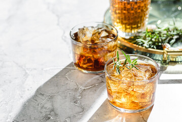 two glasses of whiskey on a tray