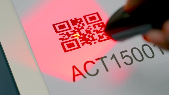 Close up wireless barcode reader to read barcode with red laser light to check the accuracy of barcode. Logistics, Import.
