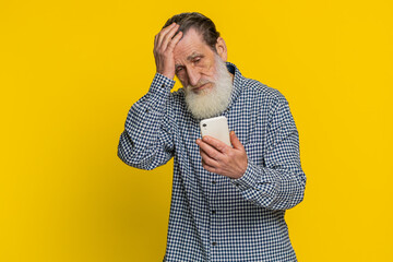Upset sad senior man use smartphone typing browsing, play game, loses, surprised by sudden lottery...
