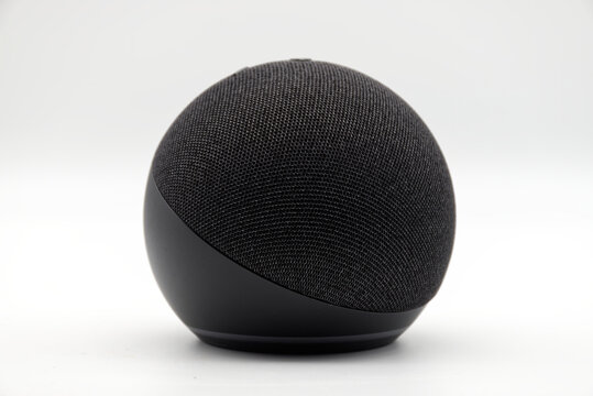 Bologna - Italy - July 23, 2024: Amazon Echo Dot. Alexa, virtual assistant AI on white.