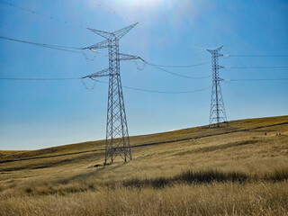 Row of High Voltage Electrical Towers in the Andes of South America