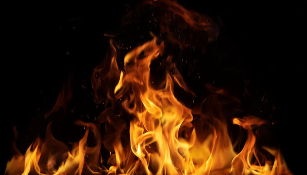 ire burns, waving back and forth by the wind at night on a black