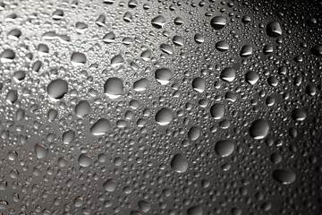 Water drops on white background texture. backdrop glass covered with drops of water. bubbles in...