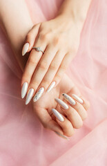 Female Hands with beautiful pearl manicure