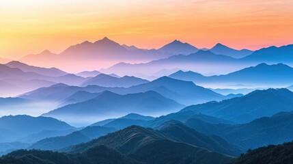 Obraz premium Stunning mountain landscape at sunrise, showcasing layers of peaks bathed in soft, colorful light and peaceful atmosphere.