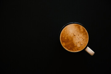 cup of coffee on black background