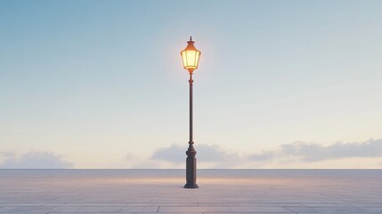 Obraz premium A single lit street lamp stands tall on a tiled ground, against a light blue sky with wispy clouds.