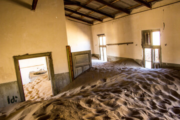 Inside an abandoned building, half buried in sand in the Namibian ghost town, Kolmannskuppe.