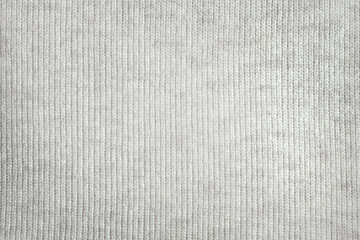 Light grey knitted texture background, gray knitted pattern