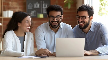Three young adults, two men and one woman, are joyfully engaged around a laptop in a cozy, modern workspace, showcasing collaboration and friendship.