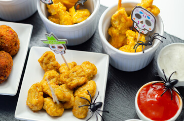 A plate of food with a skull decoration on it
