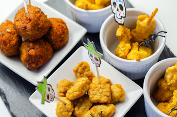 A plate of food with a skull decoration on it