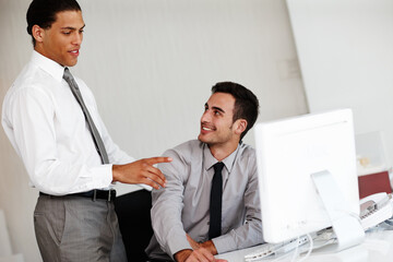 Obraz premium Business people, employee and coach with desktop in office, research and discussion for solution. Career, men or accountant with auditor for helping, training and computer for online evaluation