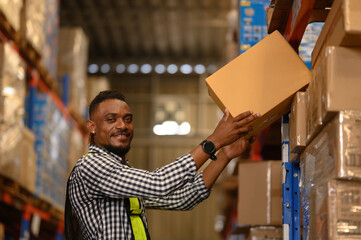 Portrait of black man worker working in large warehouse retail store industry factory. Rack of stock storage. Cargo in ecommerce and logistic concept. Depot. People lifestyle. Shipment service.