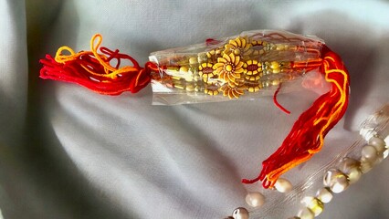 Rakhi on white background. Happy rakshabandhan