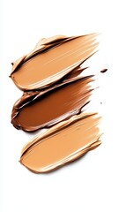 Swatches of various shades of foundation applied on a clean surface for makeup testing