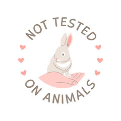 Cruelty free doodle hand drawn icon. Not tested on animals logo sticker for animal friendly product packaging. Cute cartoon rabbit on hand with text. Vegan eco cosmetics. Simple colorful round badge