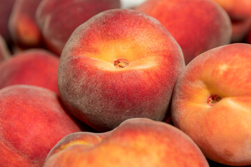 Ripe and juicy peaches in a box
