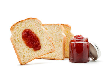 Slices of white bread with jar of strawberry jam on white background.