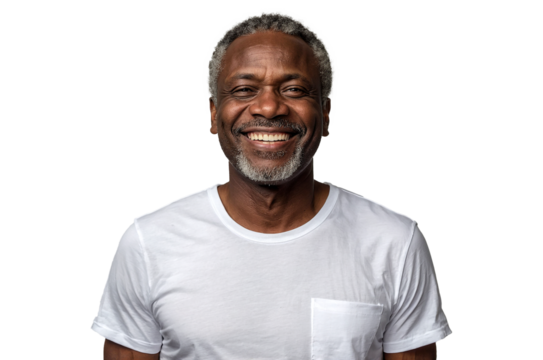 Portrait of a middle-aged African man with a warm smile, wearing a plain white t-shirt, standing with his hands in his pockets