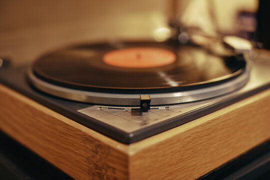 Turntable playing an album in a recording studio