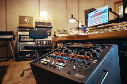 Music recording studio filled with audio equipment