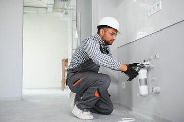 Indian Plumber installs or change water filter