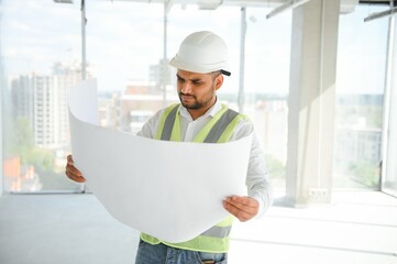 Portrait of a Indian engineer posing at the camera