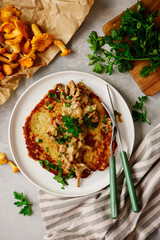 Potato pancakes with creamy chanterelle sauce. Polish cuisine .top veiw