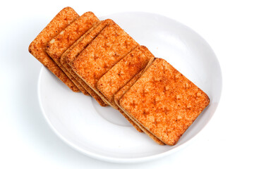 A stack of crackers with beef floss flavor. Isolated on white background. Perfect for design element, product packaging, promotion, or any commercial purposes.