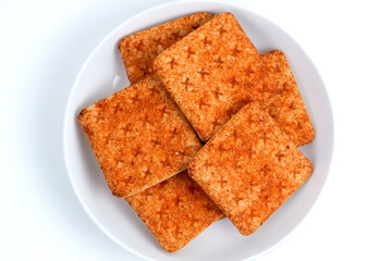 A stack of crackers with beef floss flavor. Isolated on white background. Perfect for design element, product packaging, promotion, or any commercial purposes.