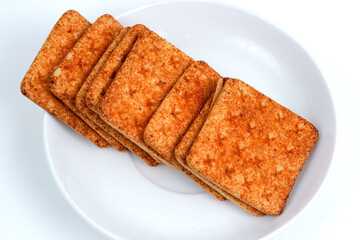 A stack of crackers with beef floss flavor. Isolated on white background. Perfect for design element, product packaging, promotion, or any commercial purposes.