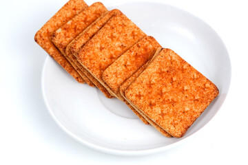 A stack of crackers with beef floss flavor. Isolated on white background. Perfect for design element, product packaging, promotion, or any commercial purposes.