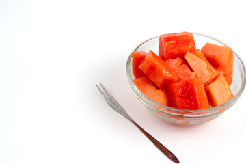 papaya slices in clear bowl isolated white background. Perfect for design element, product packaging, promotion, or any commercial purposes.