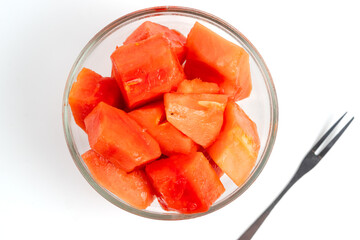 papaya slices in clear bowl isolated white background. Perfect for design element, product packaging, promotion, or any commercial purposes.