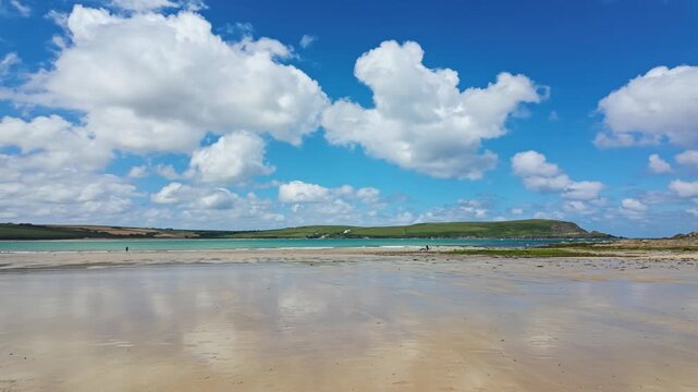 Pan, right to left from Daymers Bay, Beach with reflection of clouds in wet sand at low tide