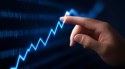 A close-up of a hand touching a glowing upward trend line, symbolizing growth and success in business or finance.