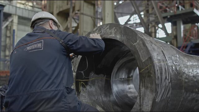 Flaw detector. Stock clip. Worker performs magneto powder flaw detection. Worker with non-destructive testing device on metal part