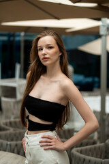  beautiful stylish fashion woman posing near modern building