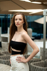  beautiful stylish fashion woman posing near modern building