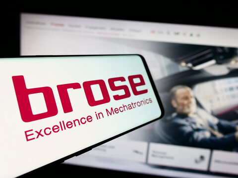 Stuttgart, Germany - 08-01-2024: Smartphone with logo of German automotive company Brose Fahrzeugteile SE Co. KG in front of website. Focus on center-left of phone display.