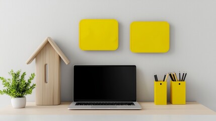 Minimalist Home Office Setup with Laptop, Wooden House Decoration, and Yellow Accents