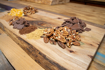 A delicious ingredients used to make chocolate monkey bread on a wooden chopping board