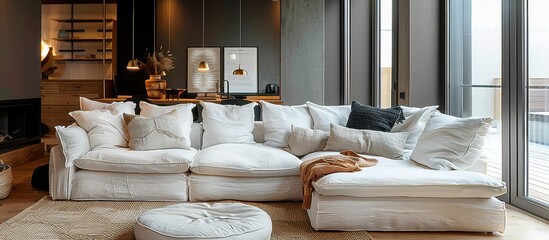 Cozy Modern Living Room with Large White Sofa and Floor-to-Ceiling Windows in Contemporary Home