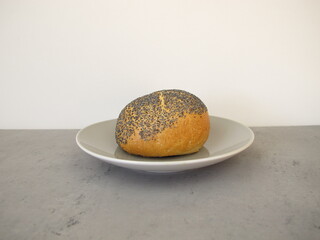 A poppy seed roll on a plate